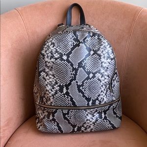 Mossimo snakeskin backpack chic + functional 🌟